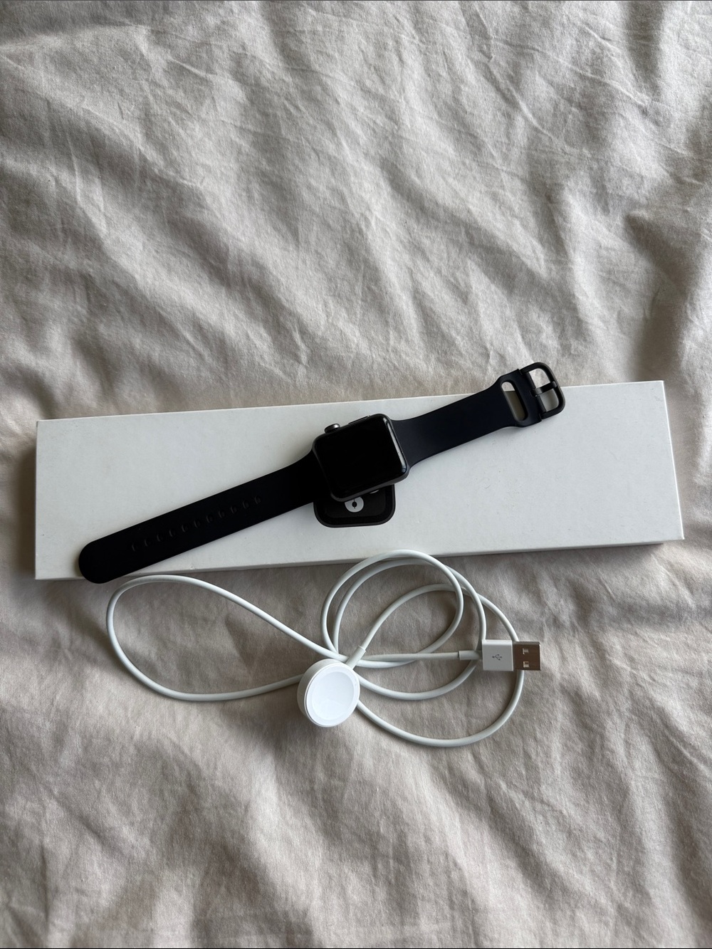 Black Smartwatch with Black Silicone Band and Magnetic Charger